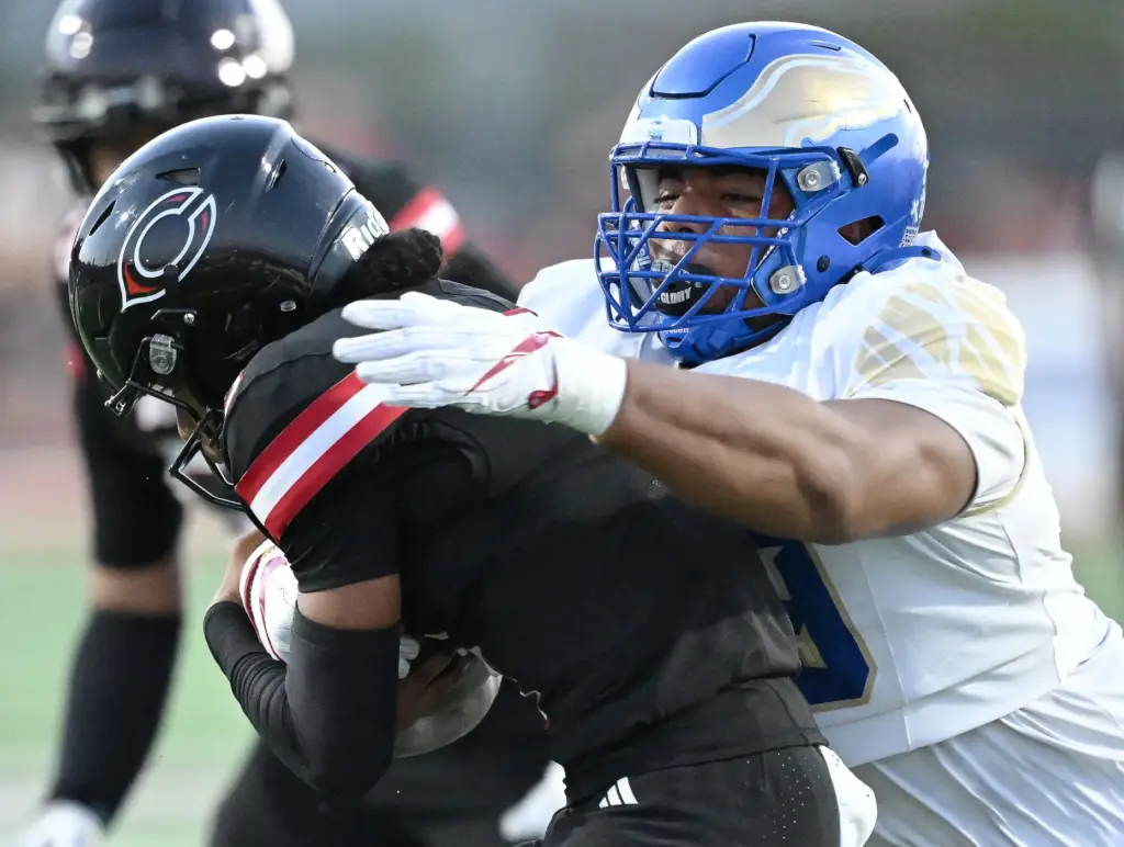 Santa Margarita defensive lineman Kingston Jimmerson (99) sacks Centennial quarterback...
