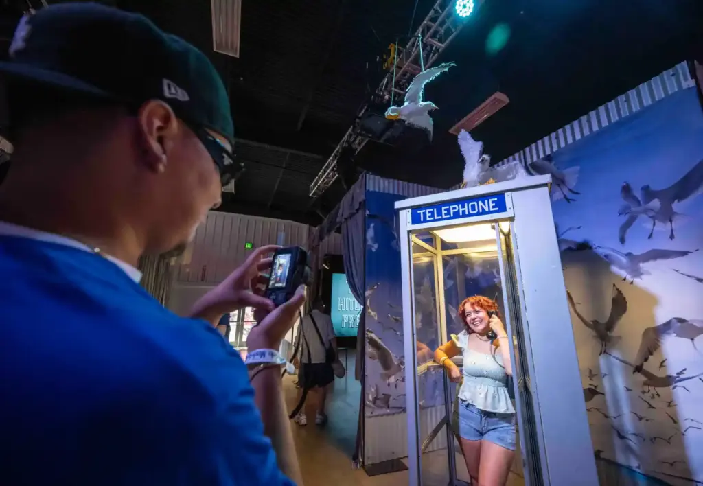 Monique Ortiz of Downey stands in a phone booth at...