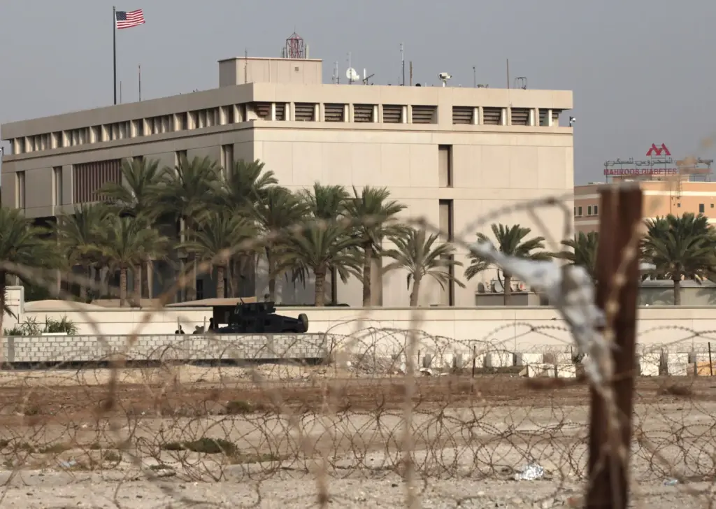 FILE – A Bahraini armored personnel vehicle and personnel reinforce...