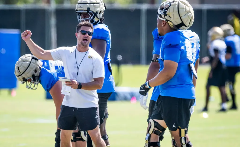 UCLA head coach Bob Chesney talks to players during the...