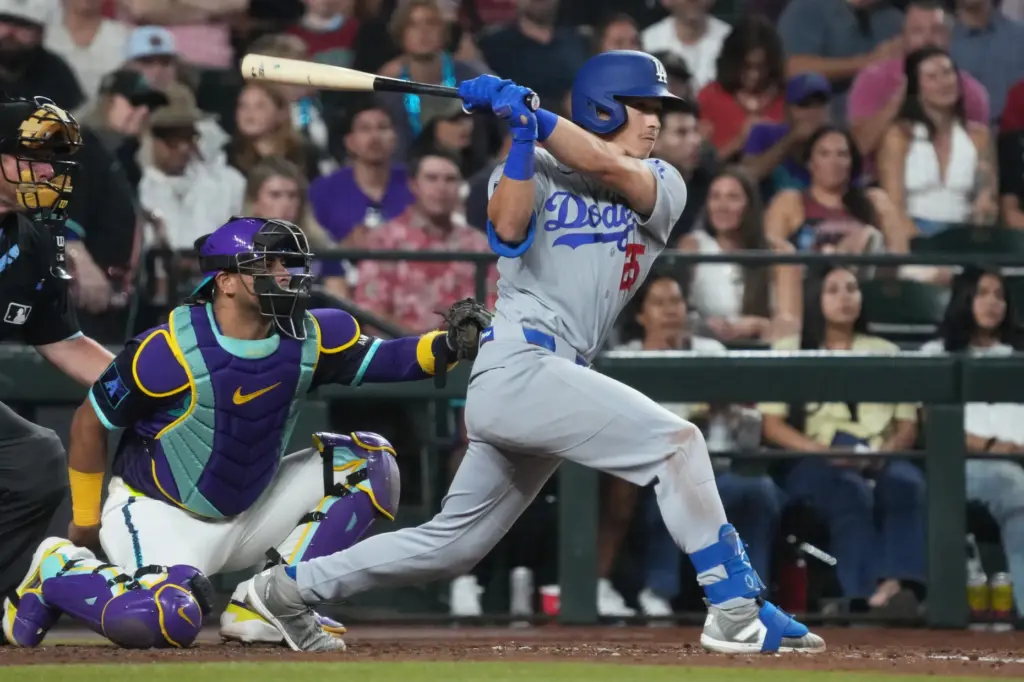 The Dodgers’ Tommy Edman hits a single during the sixth...