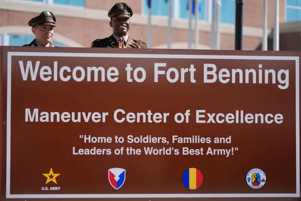 FILE – Members of the Army military stand behind a...