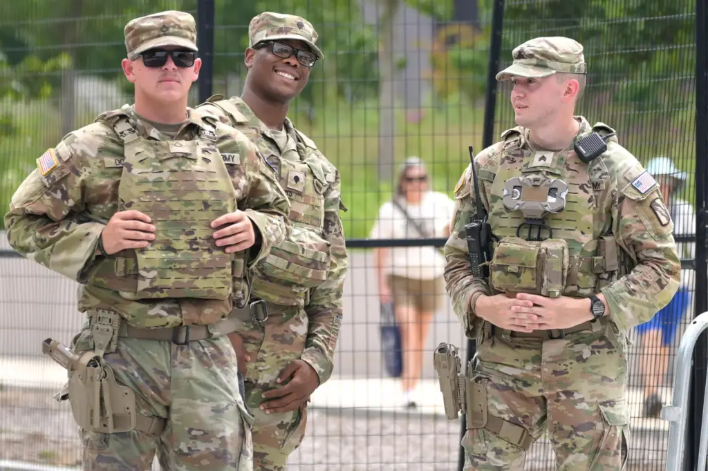National Guard members patrol near the National Mall, Monday, July...