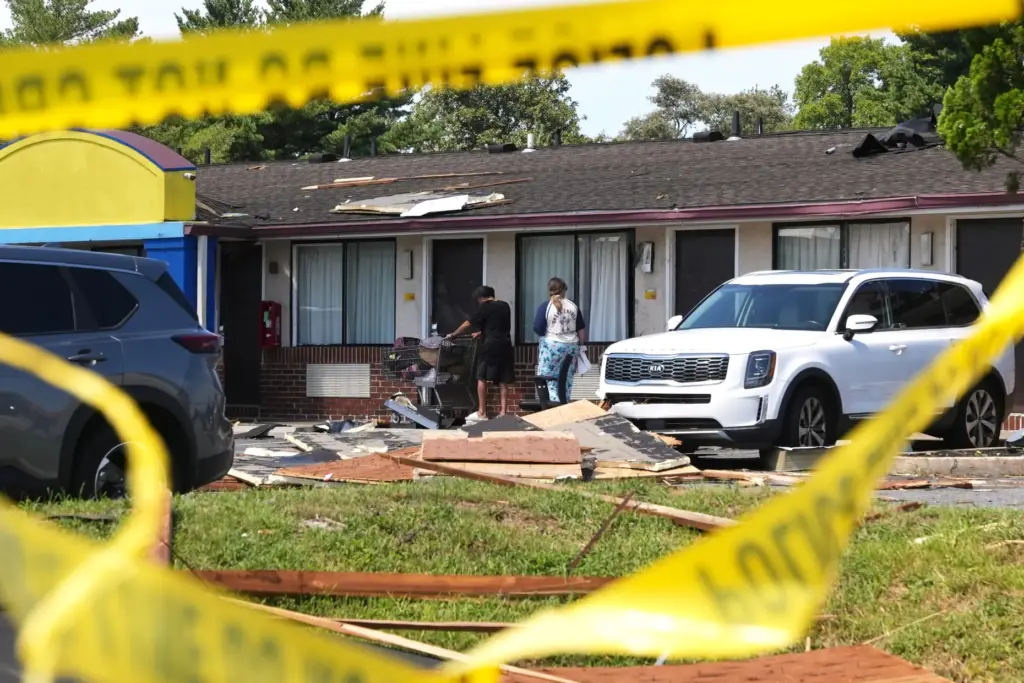 Hotel residents return to the tornado-damaged Days Inn by Wyndham...