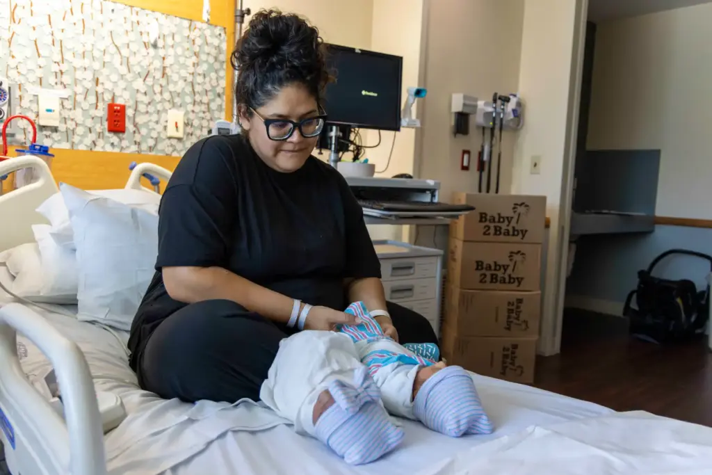 Alicia Salgado lays her newborn twins next to each other...
