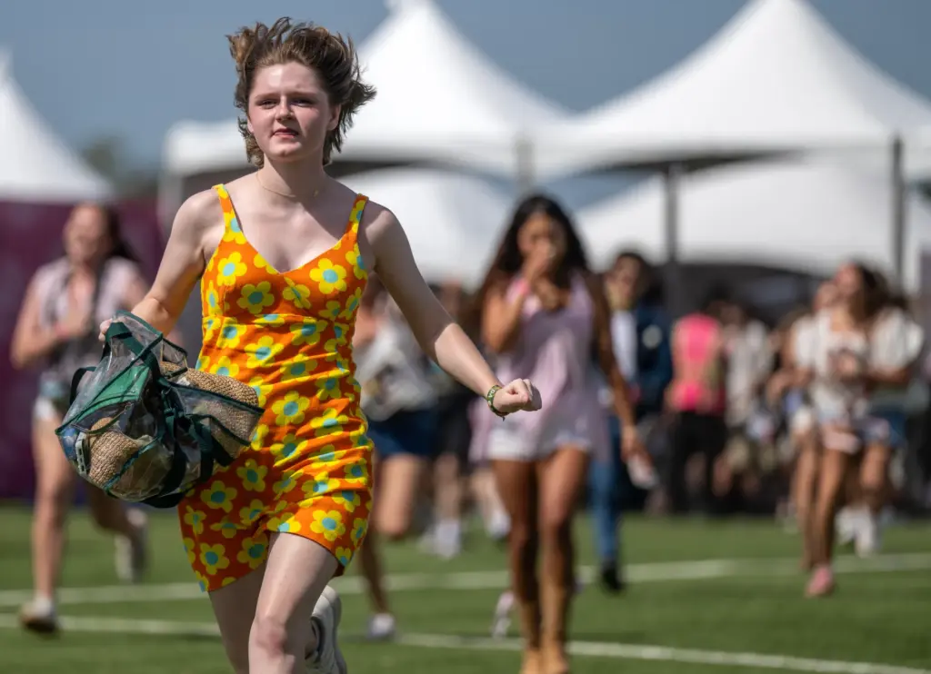 Festivalgoers sprint into the grounds as the gates open for...