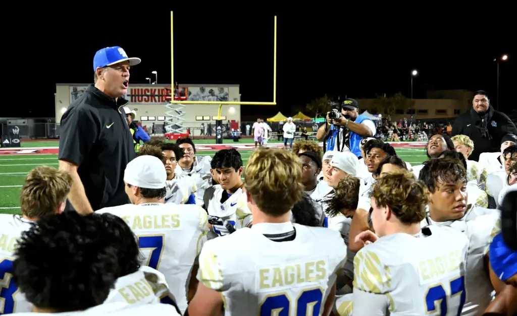 Santa Margarita head coach Carson Palmer talks with his team...