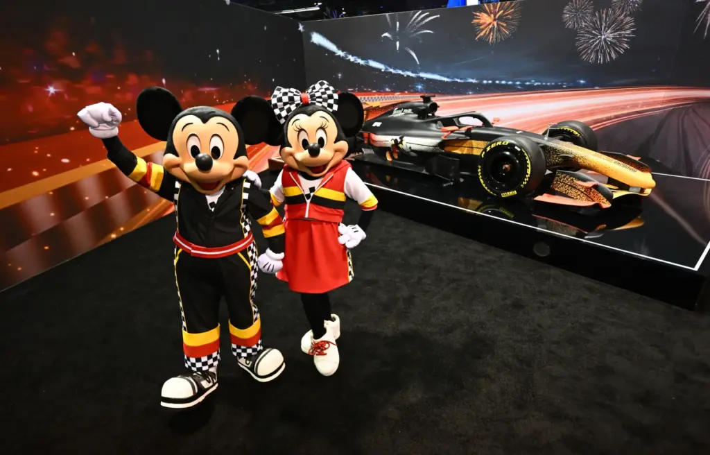 Mickey Mouse and Minnie Mouse don their racing gear in...