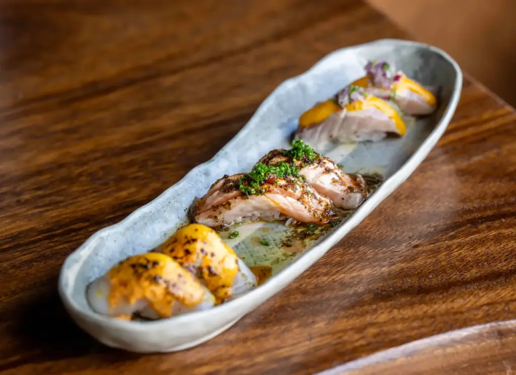 Rocoto Pesca Barâs sushi sampler is a Japanese-Peruvian dish featuring...