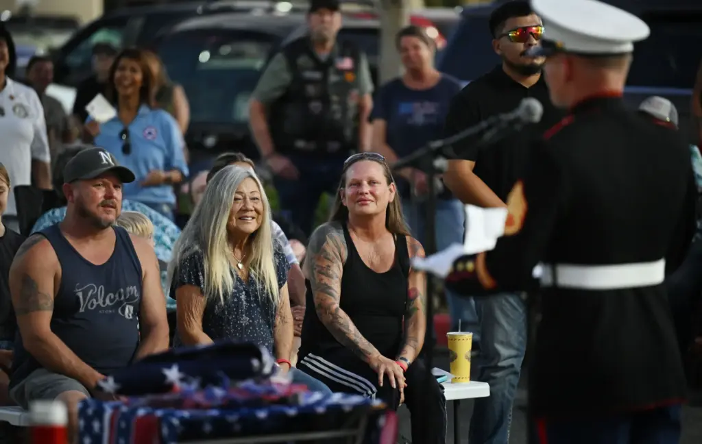 Marine Lance Cpl. Kareem Nikouiâs mother Shana Chappell, third from...