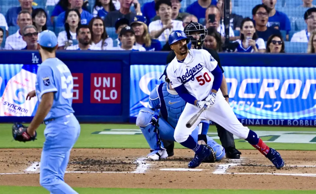The Dodgers’ Mookie Betts watches the flight of his solo...