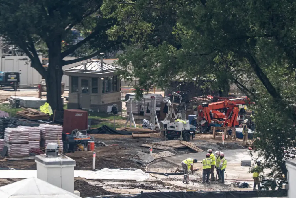 Workers use a jackhammer on the helipad on the South...