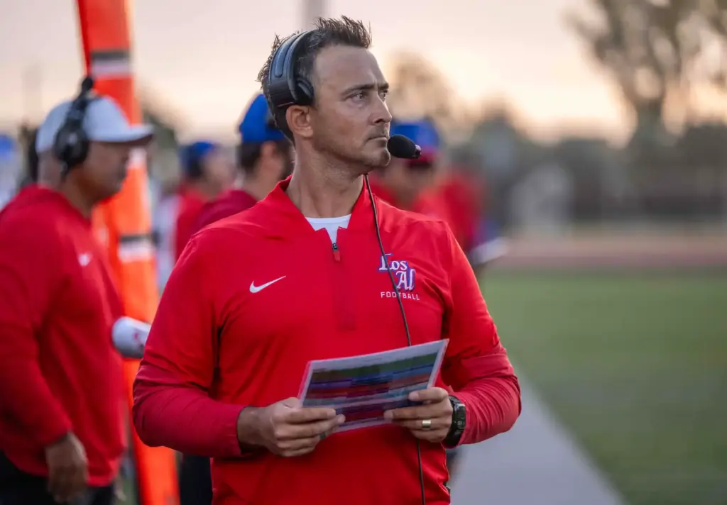 Los Alamitos new head football coach Rory Schoonmaker watches his...