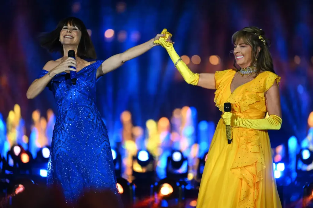 Paige O’Hara, animated Belle, and Susan Egan, original Belle on...