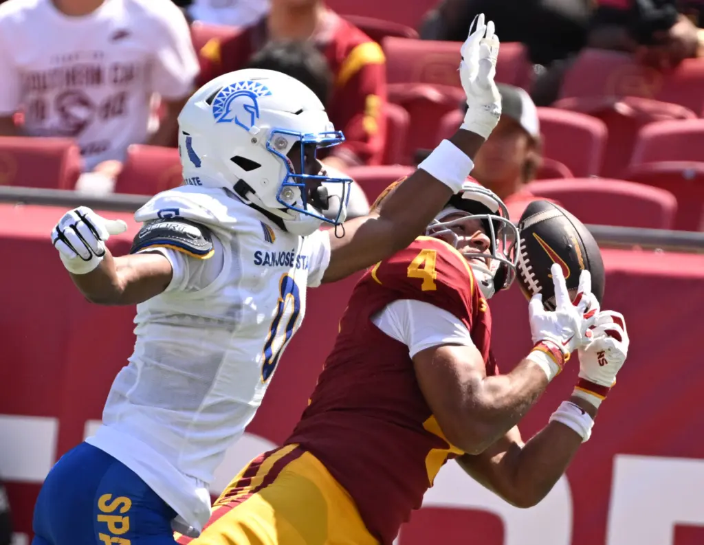Wide receiver Trent Mosley (4) of the USC Trojans reaches...