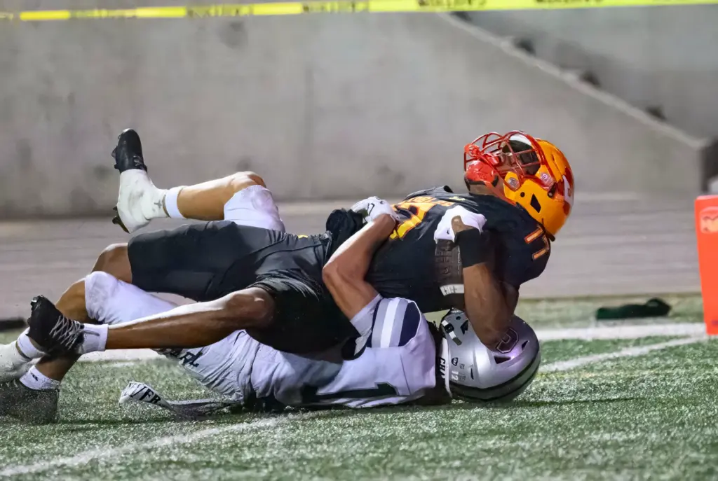 Mission Viejo wide receiver Jeremy Bonhomme (11) scores a touchdown...