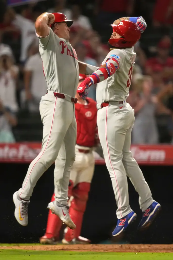 The Philadelphia Phillies’ Edmundo Sosa, right, celebrates with teammate J.T....