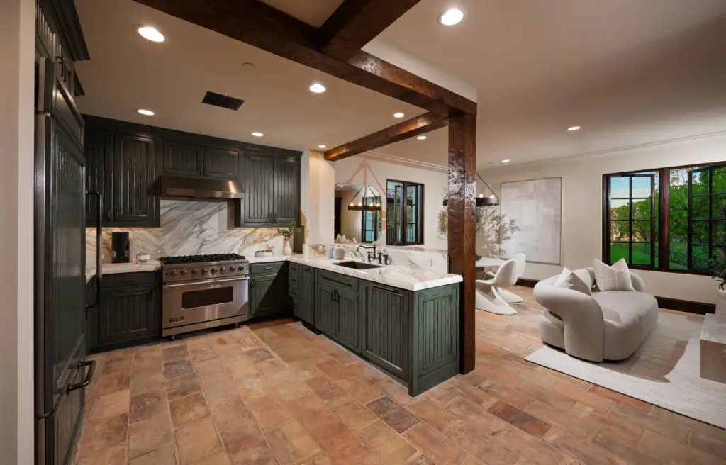 The guest house kitchen opens to a combined living and...