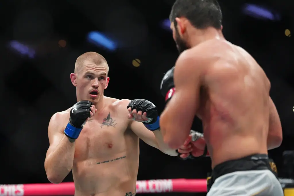 Ian Machado Garry, left and Islam Makhachev battle in a...