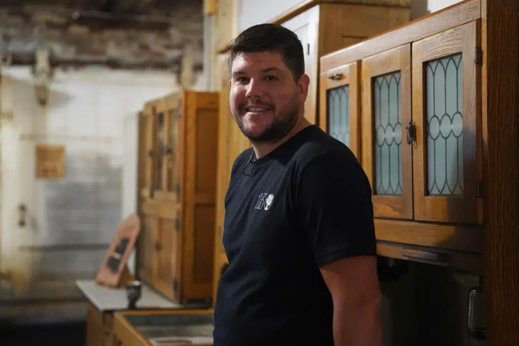 Wesley Mast, owner and president of Coppes Napanee, poses for a photo in the company's museum.