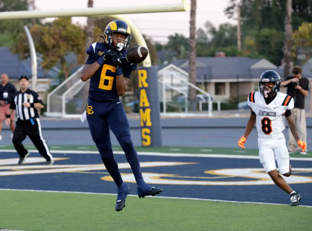 Millikans Josiah Carter (6) tries to intercept a pass for...