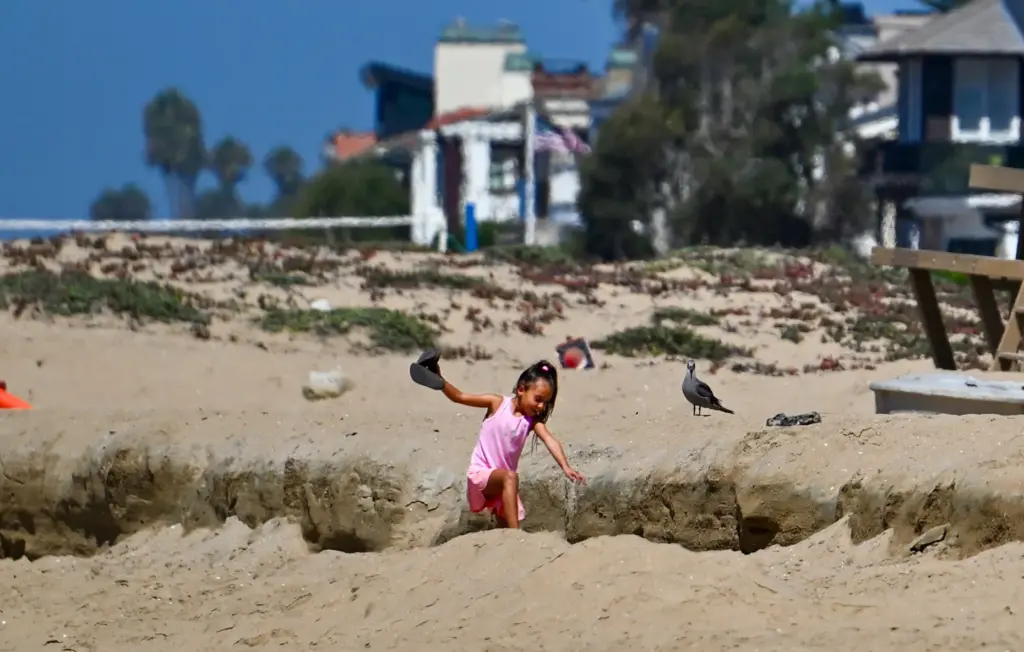 Ezlyn Norton plays in an area of old erosion at...