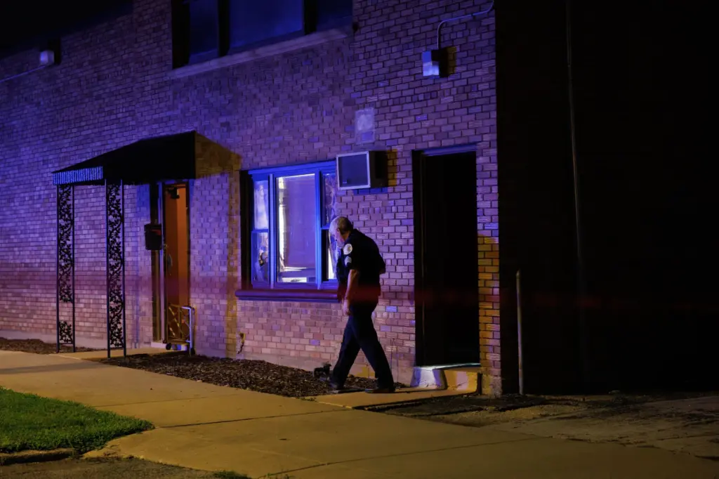 A Chicago police officer works outside the South Chicago Chapel...