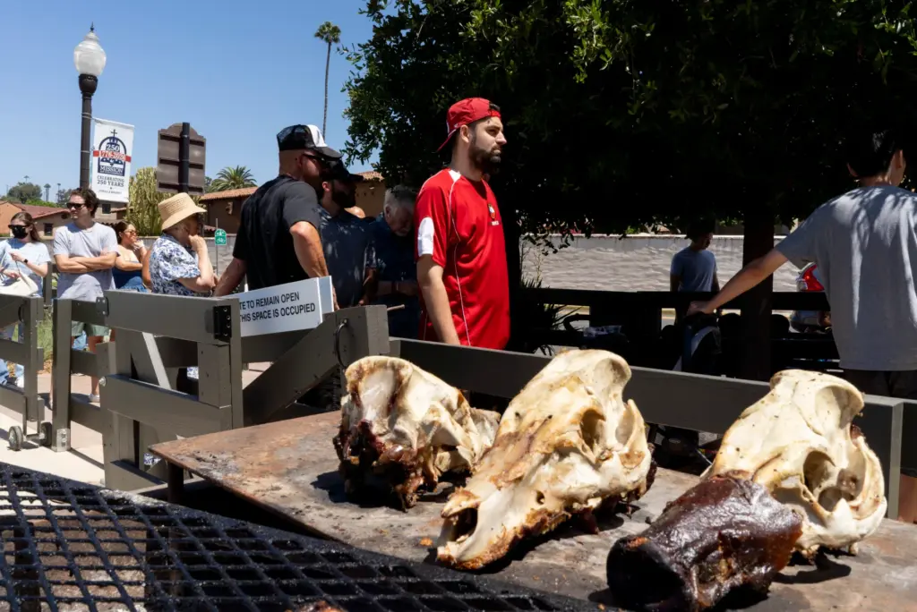 Michael Falino waits in line at Heritage Barbecue beside the...