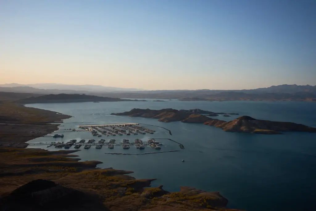 Boats are moored at a marina on Lake Mead at...