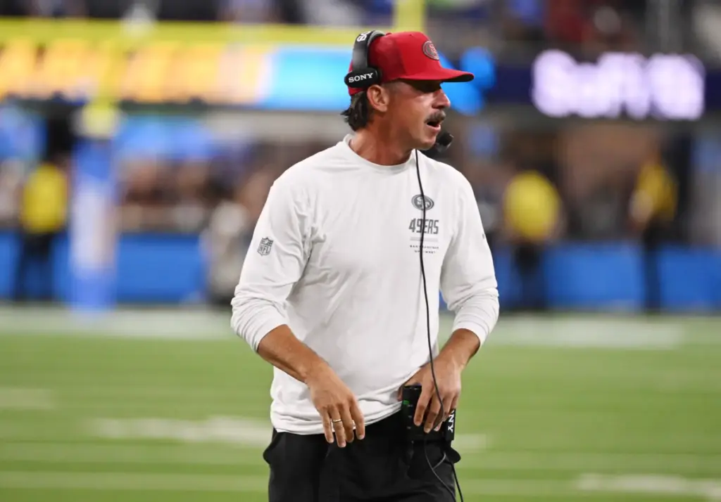 San Francisco 49ers head coach Kyle Shanahan looks on from...