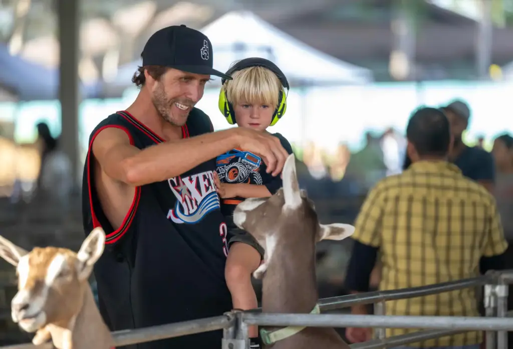 Robin Krumholz of Huntington Beach holds his son, Forrest Krumholz,...