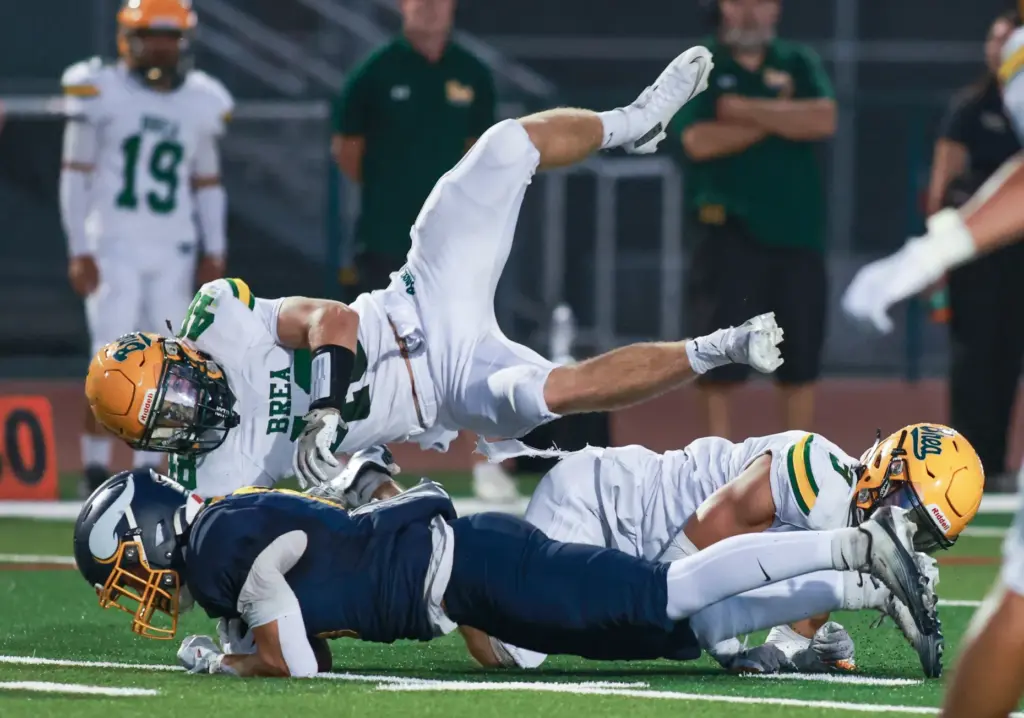 Brea Olindaâs (48) Nick Davis, is brought down by Marinaâs...