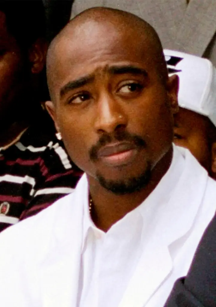 FILE – Rapper Tupac Shakur attends a voter registration event...