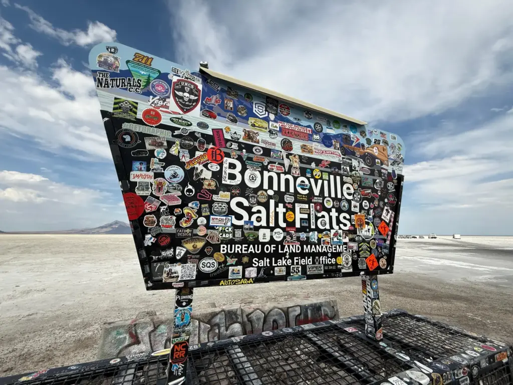 Racing stickers cover a sign for Utah’s Bonneville Salt Flats,...