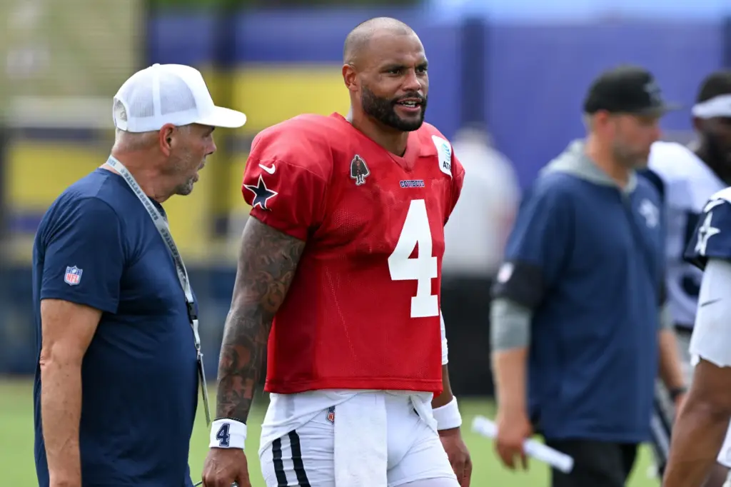 Dallas Cowboys starting quarterback Dak Prescott walks on the field...