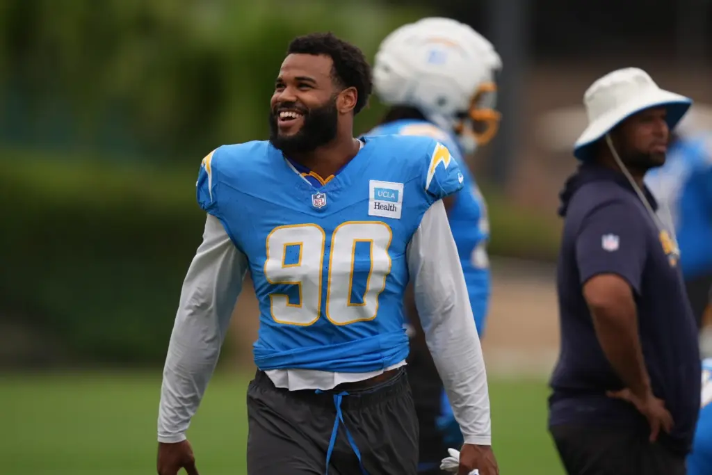 Chargers outside linebacker Akheem Mesidor smiles during an NFL football...
