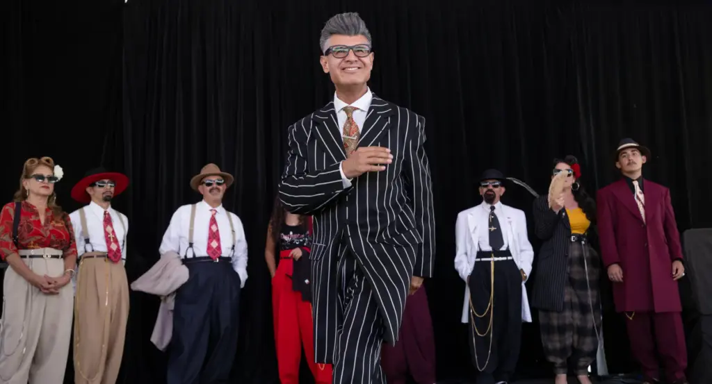 Long vertical lines accentuate Anthony Garcia’s zoot suit, which he...