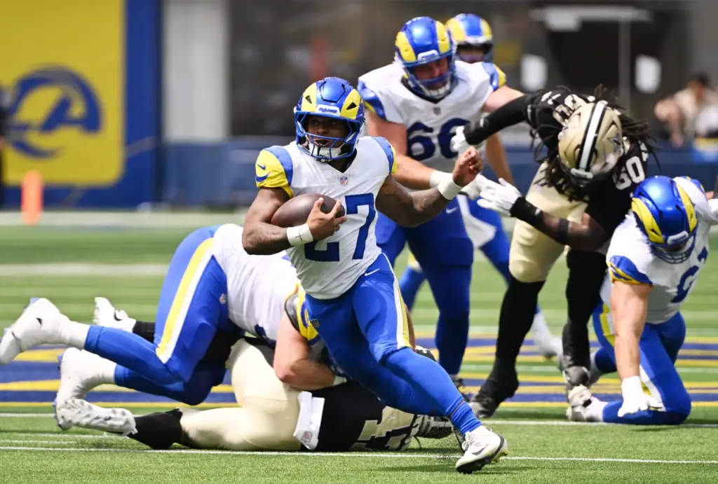Rams running back Jarquez Hunter (27) runs for a first...