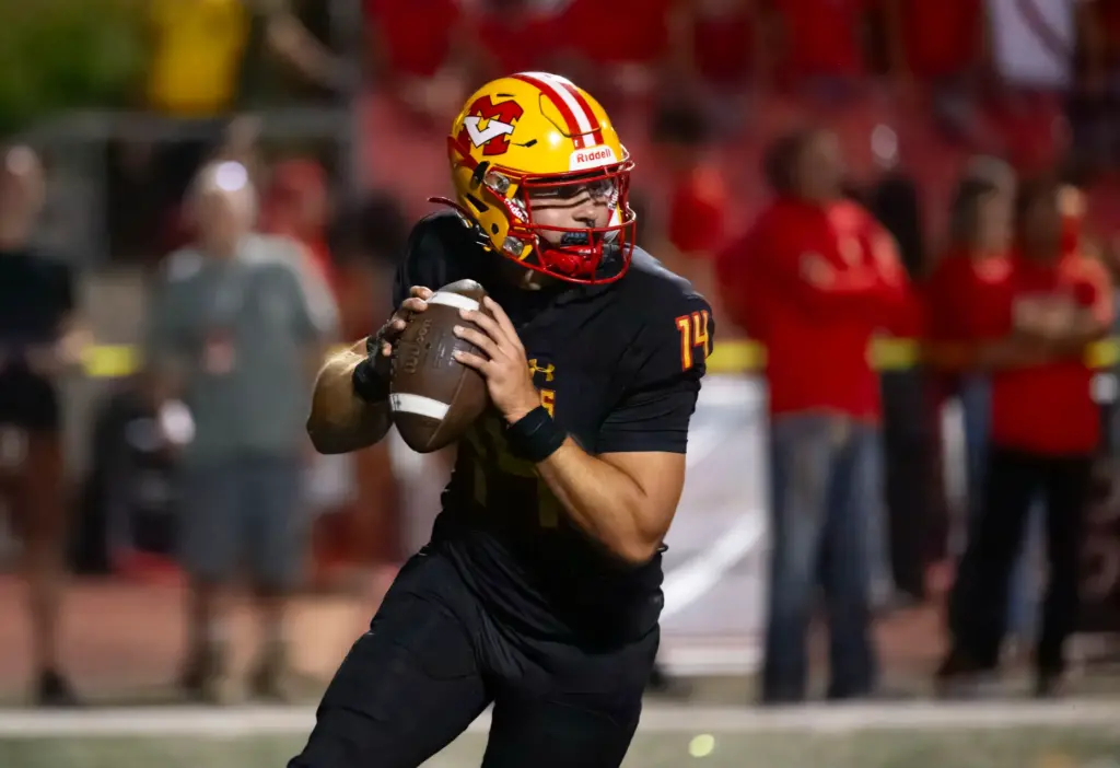 Mission Viejo quarterback Brett Burnor rolls out looking for a...