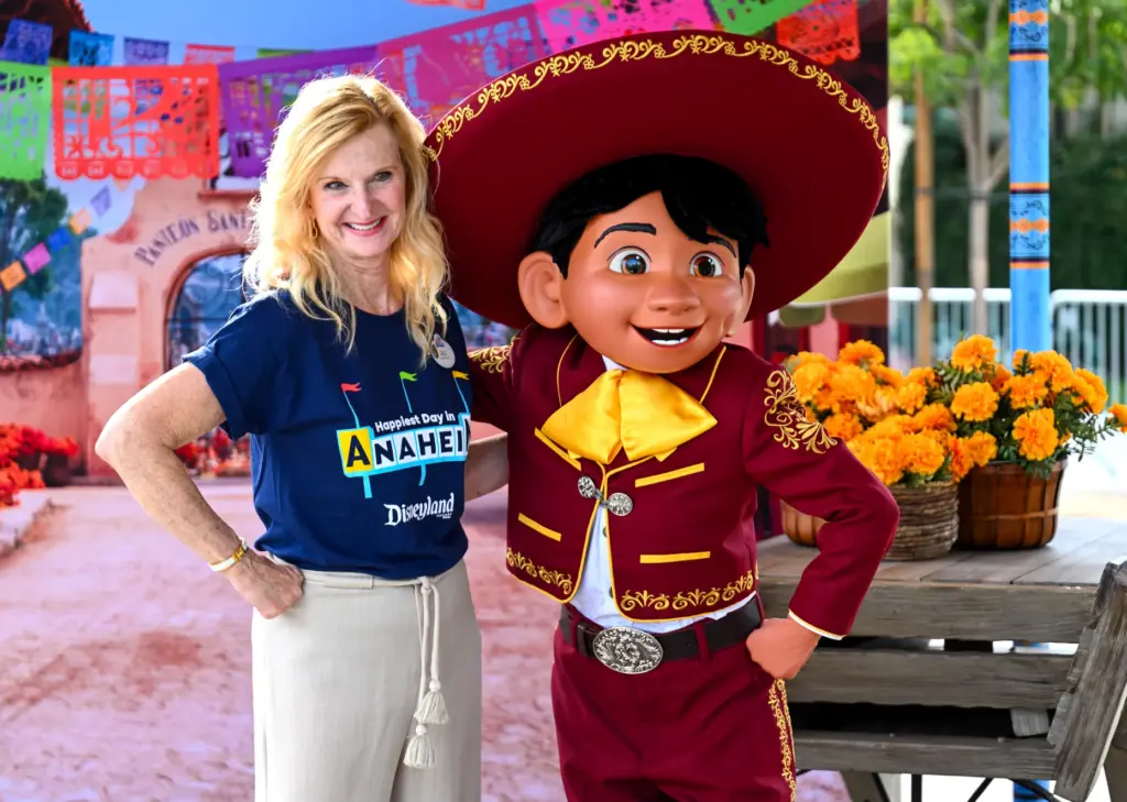 Jill Estorino, president of Disneyland Resort, hangs out with Miguel,...
