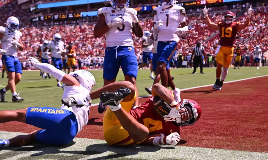 Wide receiver Trent Mosley (4) of the USC Trojans catches...
