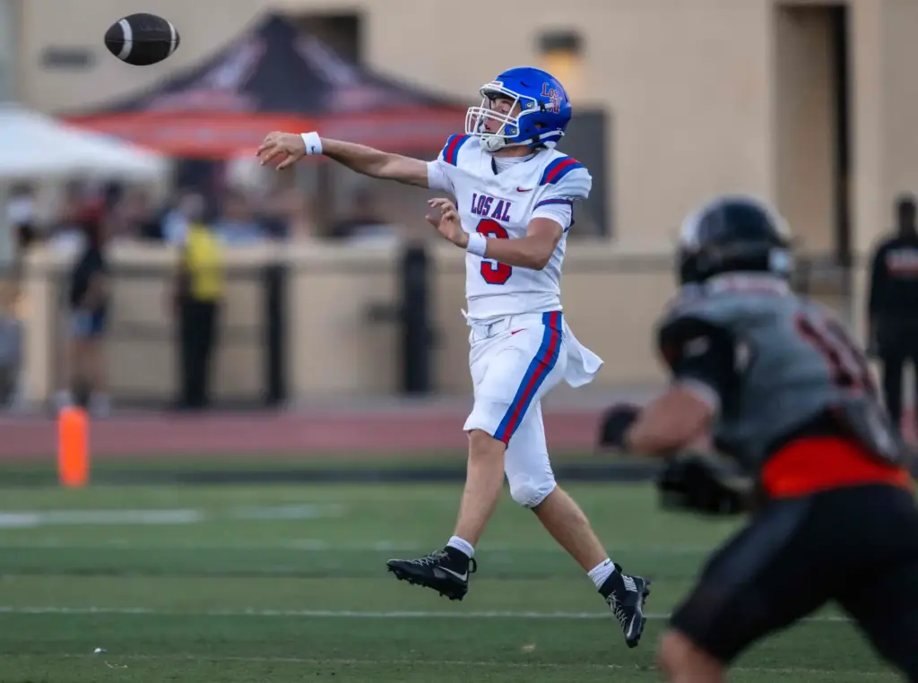 Los Alamitos quarterback Luke Osborn (9) throws the ball during...