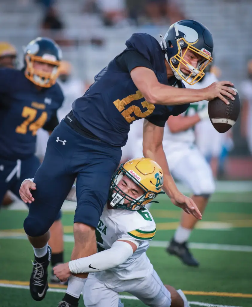 Marinaâs (12), Bishop Sherwood, left, is tackled by Brea Olinda...