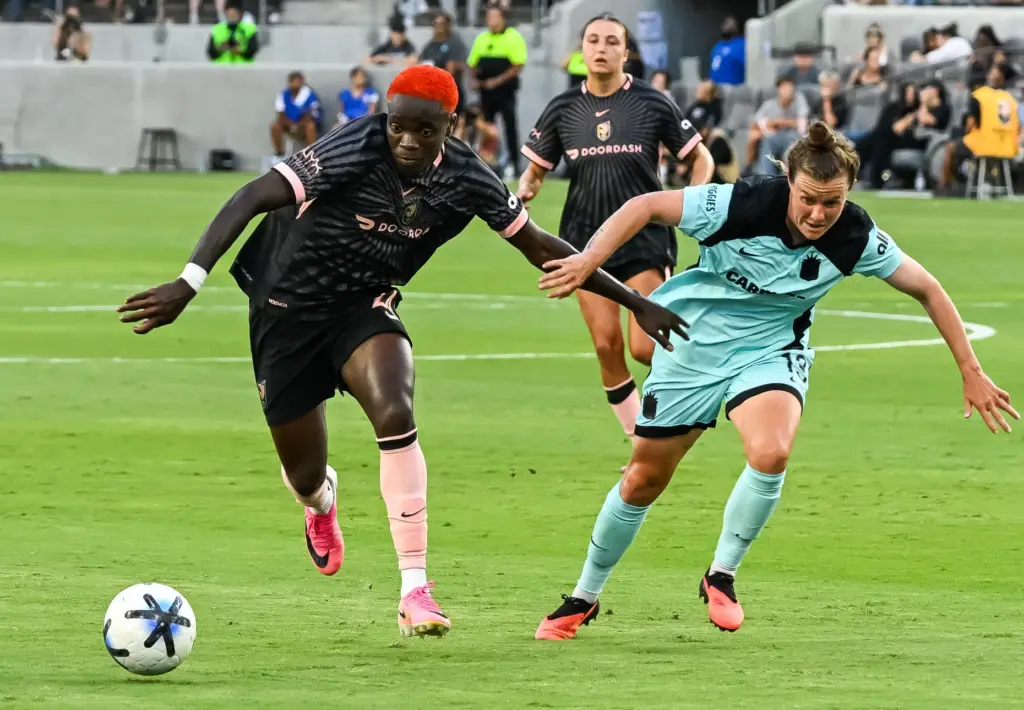 Angel City FC forward Prisca Chilufya (24) dribbles upfield against...