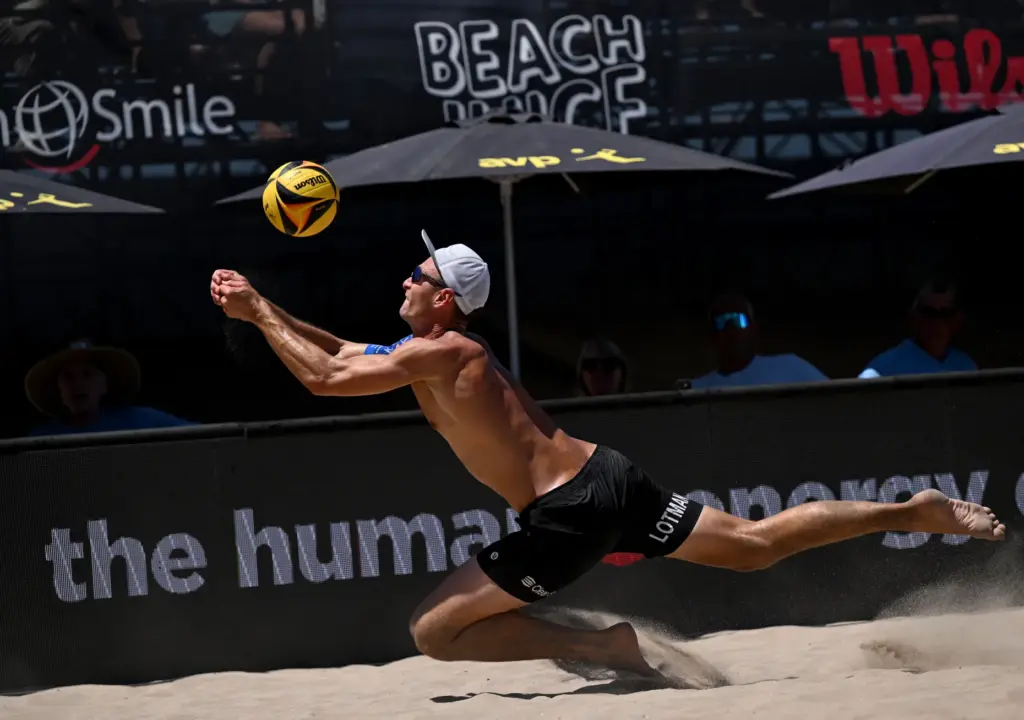 Paul Lotman rallies for a wild ball with Miles Partain...