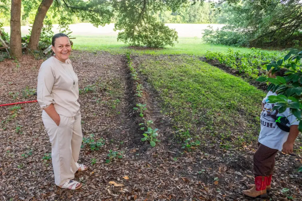 Angie Lowery grows squash, onions, potatoes and other produce in her backyard garden.