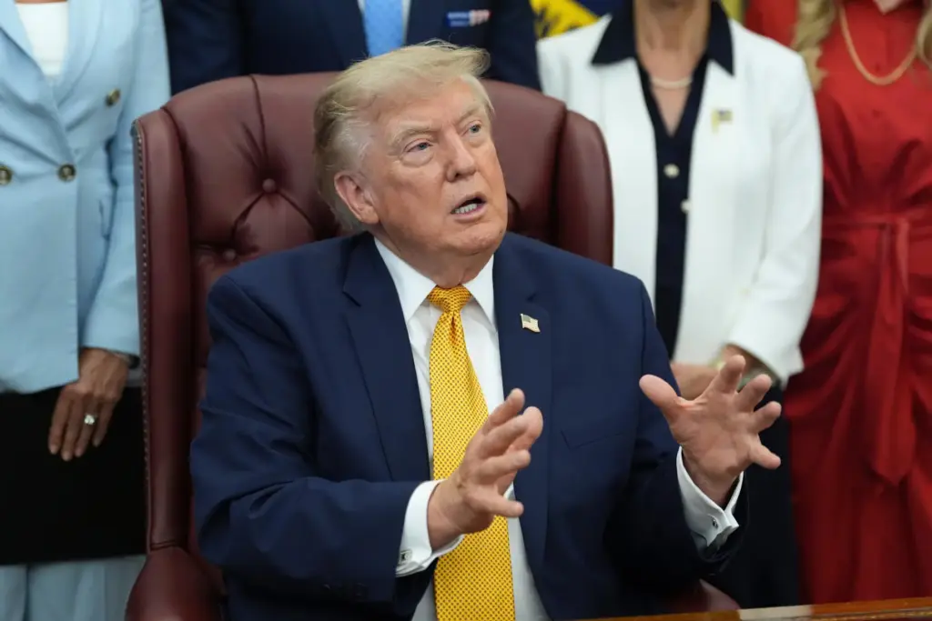 President Donald Trump speaks during a meeting in the Oval Office.