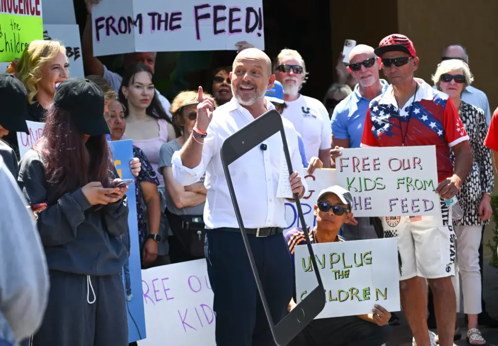 California gubernatorial candidate Steve Hilton holds an outline of a...