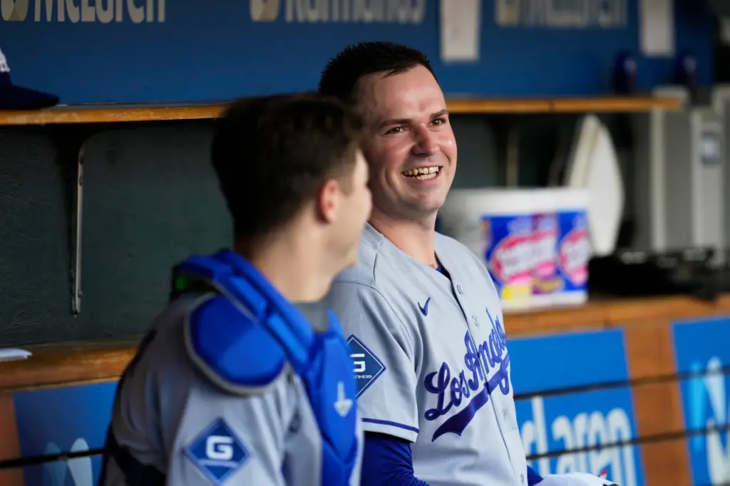 Dodgers starting pitcher Tarik Skubal smiles in the dugout during...