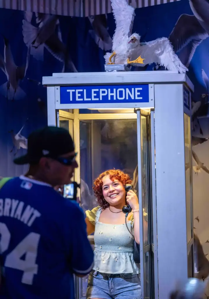 Monique Ortiz of Downey stands in a phone booth at...